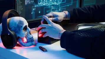 Hacker uploading script on SSD that can launch DDoS attacks on any website. Cybercriminal writing program that can crash servers, downloading it on storage drive, camera A photo