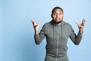 Angry irritated person screaming in front of the camera and showing his frustration, getting aggressive and furious about something. Young adult with mental health problem shows conflict. photo