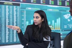 Manager and investor ensuring data management with infographics and business reports, analyzing numbers on a big screen. Shareholders reviewing global expansion plans in office. photo