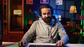 Mad gamer raging after losing online competitive multiplayer match, playing on cutting edge gaming setup. Man feeling angry and shouting after being defeated in videogames photo
