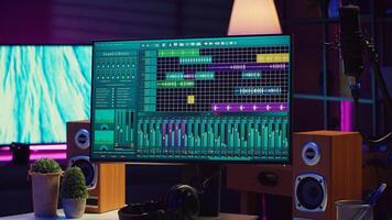 Empty space filled with mixing instruments and electronic tools, soundboard console and mastering panel used for recording tunes. Daw software on pc used in acoustical engineering. Camera A. photo