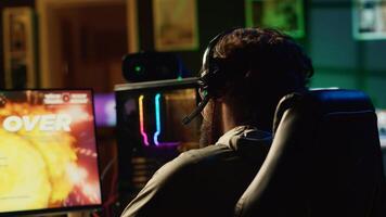 Livid gamer raging in frustration after losing mission while playing spaceship videogame. Mad player furiously yelling after getting flying spacecraft destroyed in game, receiving game over message photo