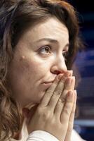 Stressed programmer praying for vulnerabilities in software systems to be fixed after applying patch. Worried woman using PC to eliminate errors, wishing to be successful photo