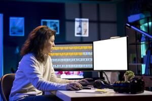 Freelancer works on isolated screen desktop computer on digital portfolio showcasing edited images. Photo editor selecting best photographs using retouching application on mockup display