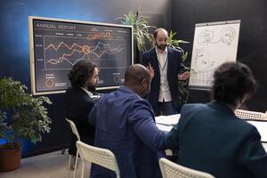 Staff assembling in a conference to debate latest events and updates on project situation, giving insight. Enterprise workers receive instruction to increase the financial business potential. photo