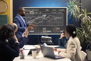 Chief operating officer presenting project updates and resource allocation during a conference, creating successful pitch to use his ideas. Review performance metrics and marketing strategies. photo