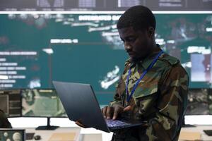 Technical engineer monitoring surveillance system from CCTV to track any hostile aircrafts, working in federal reconnaissance division bureau to ensure national safety. Big screen and high tech. photo