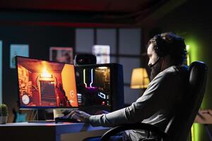 Streamer talking to viewers live, presenting gameplay, providing info and reviewing. Pro gamer broadcasting from dark apartment, greeting fans watching him on internet channel photo