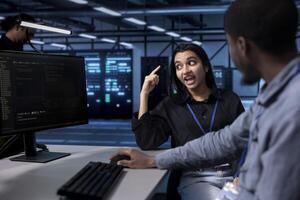 Supervisor berating employee after failing to optimize server room for data processing requirements. Manager scolding employee after being unable to make data center tech operate efficiently photo
