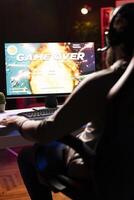 Upset gamer having to restart game from beginning after losing mission while playing spaceship videogame. Player feeling gutted after getting flying spacecraft destroyed by more powerful enemies photo