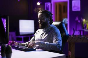 Smiling man plays online multiplayer videogame with friends, feeling happy. Cheerful player talking with teammates, enjoying leisure time, controlling character, finishing missions photo