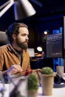 Computer technician securing company servers from DDoS attacks to avoid unwanted failures. IT specialist typing on keyboard, writing code to build firewalls protecting data from threats photo