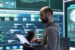 Hackers group using ransomware and phishing tactics to compromise computer networks and gather intelligence for national security and protection during cyberwarfare. Governmental spyware. photo
