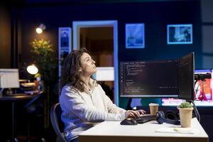 System administrator looking at AR visualization to fix vulnerabilities in software. Cybersecurity specialist using computer to patch security exposures using augmented reality tech photo