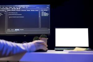 Computer scientist designing and developing software applications using isolated screen laptop. IT expert implementing and maintaining company systems using mockup notebook photo
