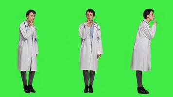 General practitioner showing hush symbol to be quiet and keep secrecy, putting finger over lips for privacy and silence expression. Medic doing mute symbol, asking to be quiet. Camera A. photo