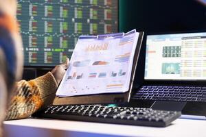 Person examining capital funds online for a new program at home, studying finances and accounting management on a software. Employee specialist doing remote work, startup analysis. photo