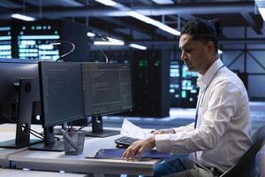 Data center IT expert developing strategies and procedures to ensure business continuity in case of disaster or system failure. Server hub employee ensuring compliance with industry regulations photo