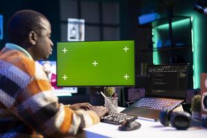 System administrator handling software optimization next to mockup copy space on terminal window, working with IT language to insert html code. Self employed coder managing database security. photo