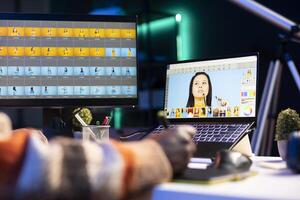 Professional graphic designer retouching images on dual monitors in a creative office environment, demonstrating multitasking skills and innovative techniques. Well organized editor. photo