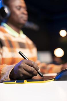 Skilled male designer using editing software on dual monitors in organized modern workspace, symbolizing the future of digital design and remote work. Digital art photo retouching.