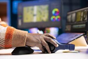 maker producing footage with artistic editing software, doing color adjustment and special effects. Digital videographer illustrator developing transitions for cinematic production. photo