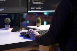 Freelancing programmer doing software debugging on computer at home, checking flaws in lines of code displayed on monitors. IT admin in apartment fixing coding issues, typing on keyboard, close up photo