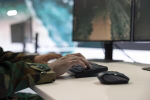 Military power base under ruling of army IT professional who analyzes registered data about a new national guard operation. Division commander major gathers intelligence for his troops. Close up. photo