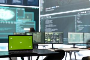 Isolated copy space running on a laptop in high tech agency office, governmental hackers analyzing digital threats on big screens. Working on cybercrime and protection against phishing. photo