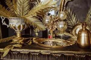 golden vase with golden branches photo