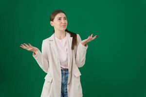Portrait of confused woman shrug in studio, isolated white background and questioning choice, emoji and reaction. Female model, confusion and dont know why in doubt, uncertainty and body language photo