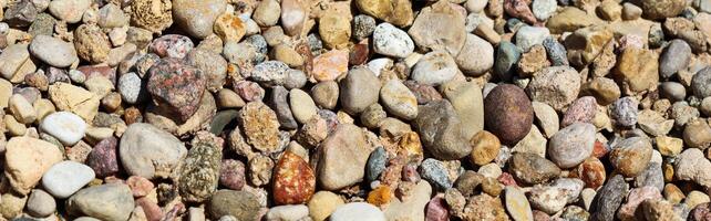 Various gravel pile for background. Sharp closeup stones for construction. Rubble texture photo