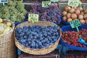 A Colorful Variety of Fresh Fruits Delightfully Displayed at Market Stall photo