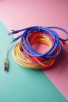 Stack of colorful elastic rubber bands on table photo