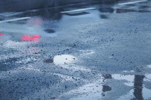 Reflections observed on the wet pavement after a rain shower has ended photo
