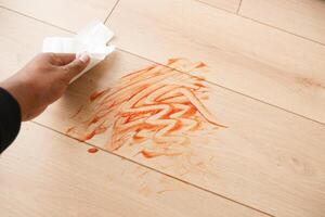 Effortlessly Cleaning a Stained Floor Using a Simple Paper Towel photo