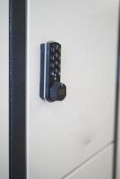 Modern Digital Lock on a White Locker Provides Secure Access Control photo