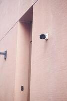 Security Camera Successfully Mounted on the Wall for Optimal Surveillance Purpose and Use photo