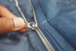 Close-up of a zipper with a slider photo
