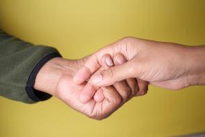 Intertwined Hands Representing Deep Connection, Trust, and Affection photo
