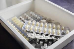 Various types of Assorted Medication Blister Packs neatly arranged in a Drawer photo
