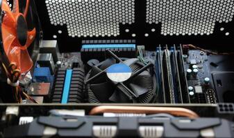 System unit of a powerful desktop computer with the cover removed. Computer hardware connection and mounting stock image photo