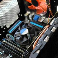 Blurred Photo Of Motherboard With Four Sticks of RAM And Powerful Coolers Inside Computer Unit