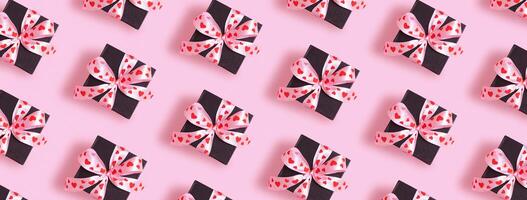 Valentines Day background with pattern from present gift box with bow top view photo