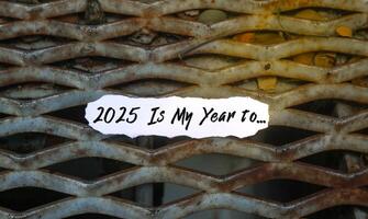 2025 Is My Year To note on torn paper with sunlight. New year concept with typographic 2025. Motivational words to welcome the new year 2025 photo