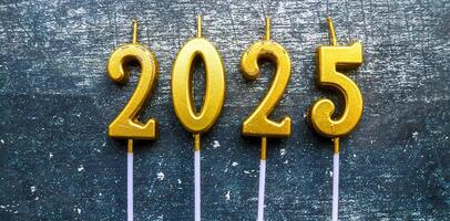 candles in shape of 2025 year with grey background photo