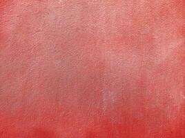 Red wall.Cement Red plaster wall have rough surface concrete. For texture background images.Red paper background, colorful paper texture. photo
