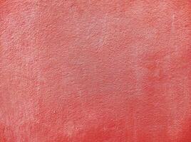 Red wall.Cement Red plaster wall have rough surface concrete. For texture background images.Red paper background, colorful paper texture. photo