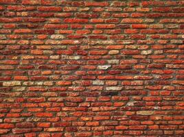 Red brick wall. Texture of old dark brown and red brick wall panoramic backgorund.Old red brick wall background, wide panorama of masonry.red brick wall texture grunge background. photo