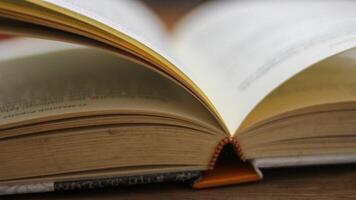 Close-up of an open book, showing the edges of the pages photo